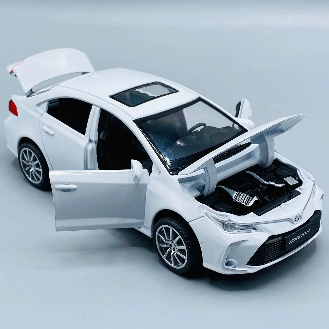 14b0cc3858703c279fae5e5909929b1b Corolla Toy Car with Smart Sensor Touch High-Quality Kids Toy Vehicle (Random Colors Available) - Image 4