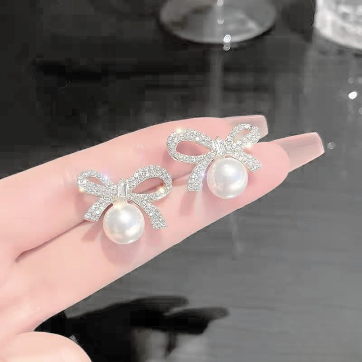 6274357f928b5a2d8db875427dc4ae23 Bow Knot Pearl Earrings with Zircon – Korean Style (PJX-113) - Image 4