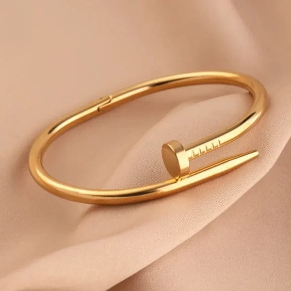 7445c071d994b232dee8bafc4aac7043 QVT-139 Cartier Nail Bangle – Stainless Steel | Iconic Luxury Design (Golden) - Image 3