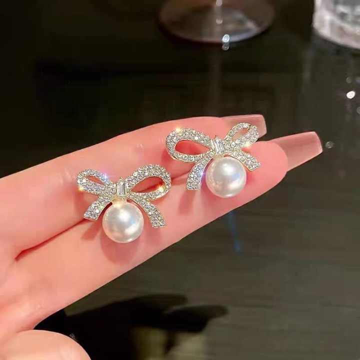 adcad8bfd9ae87827a530b93746f55e1 Bow Knot Pearl Earrings with Zircon – Korean Style (PJX-113) - Image 3