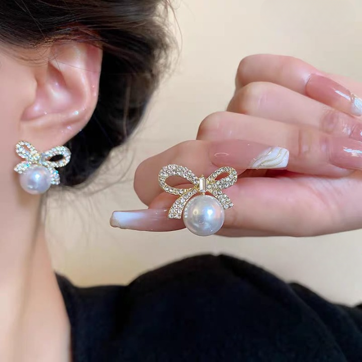 c3f2b3a43070983f836dc14185f400f3 Bow Knot Pearl Earrings with Zircon – Korean Style (PJX-113) - Image 2