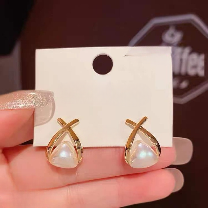 d40c3571e7f64f562e3c3265c51bec9f Trendy Korean Cross Pearl Earrings – Sculpted Design (AVT-114) - Image 3
